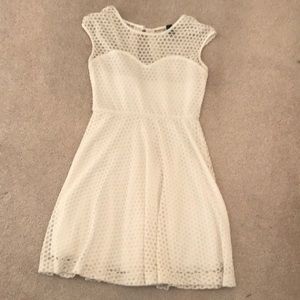 The top of the dress is mesh all lace polka dot